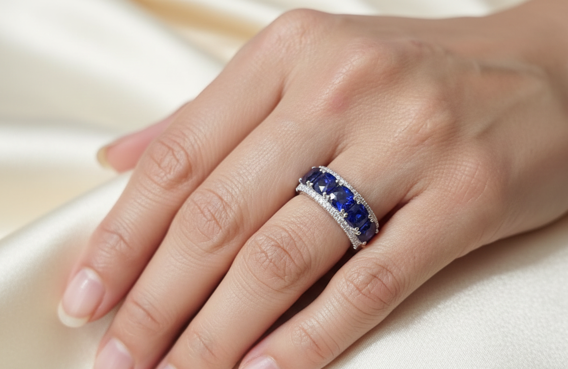 18K white gold blue sapphire and diamond band ring with 2.84 carat sapphires and pavé diamond accents by Emirates Diamonds