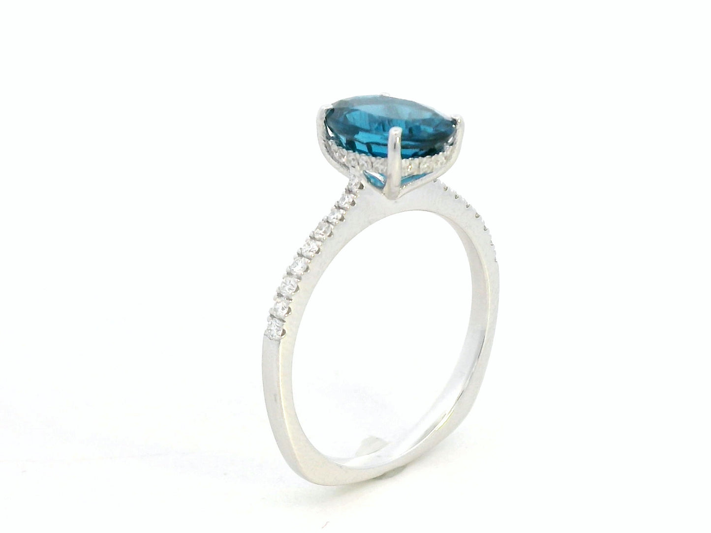18K white gold ring featuring a 2.66 carat oval London Blue Topaz with diamond-set band, total diamond weight 0.25 carat – Emirates Diamonds
