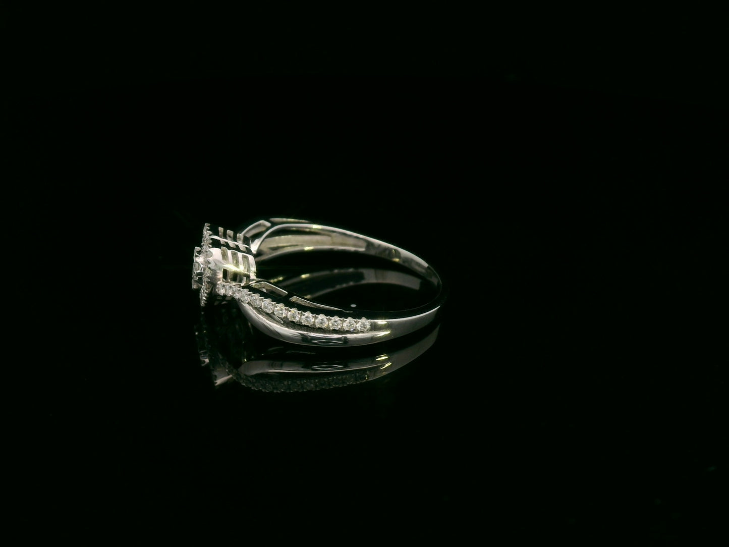Heart-shaped diamond cluster ring in 18K white gold with pavé diamond band by Emirates Diamonds.