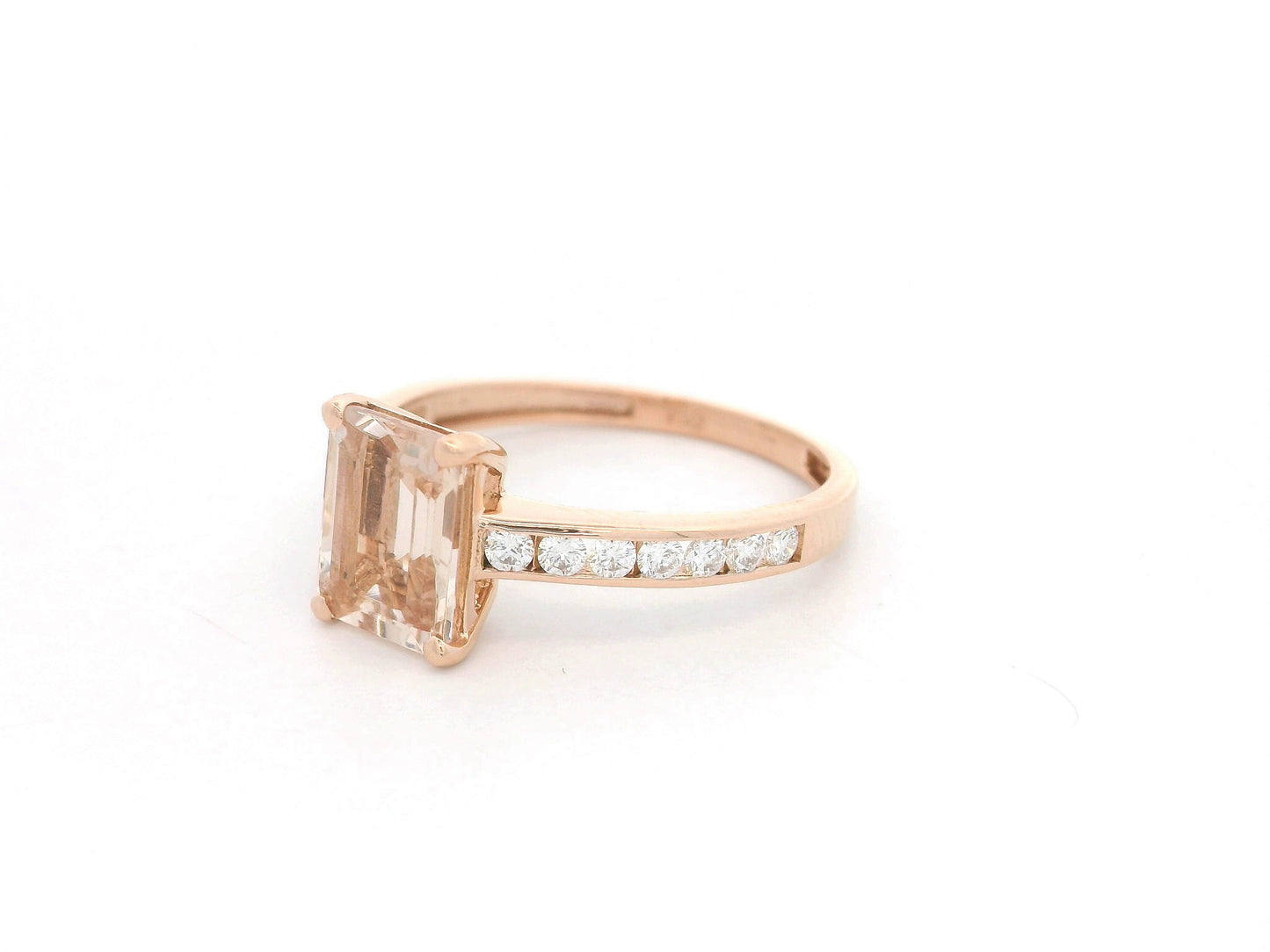 Emerald-cut morganite and diamond ring in 18K rose gold with 1.41 carat morganite and diamond band by Emirates Diamonds.