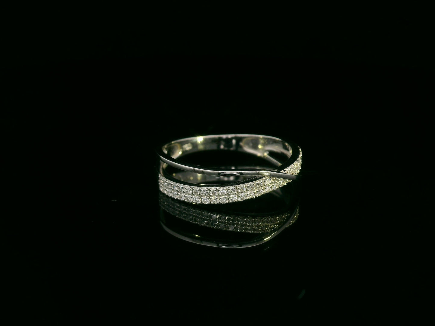 18K white gold diamond crossover ring featuring 0.20 carats of diamonds by Emirates Diamonds
