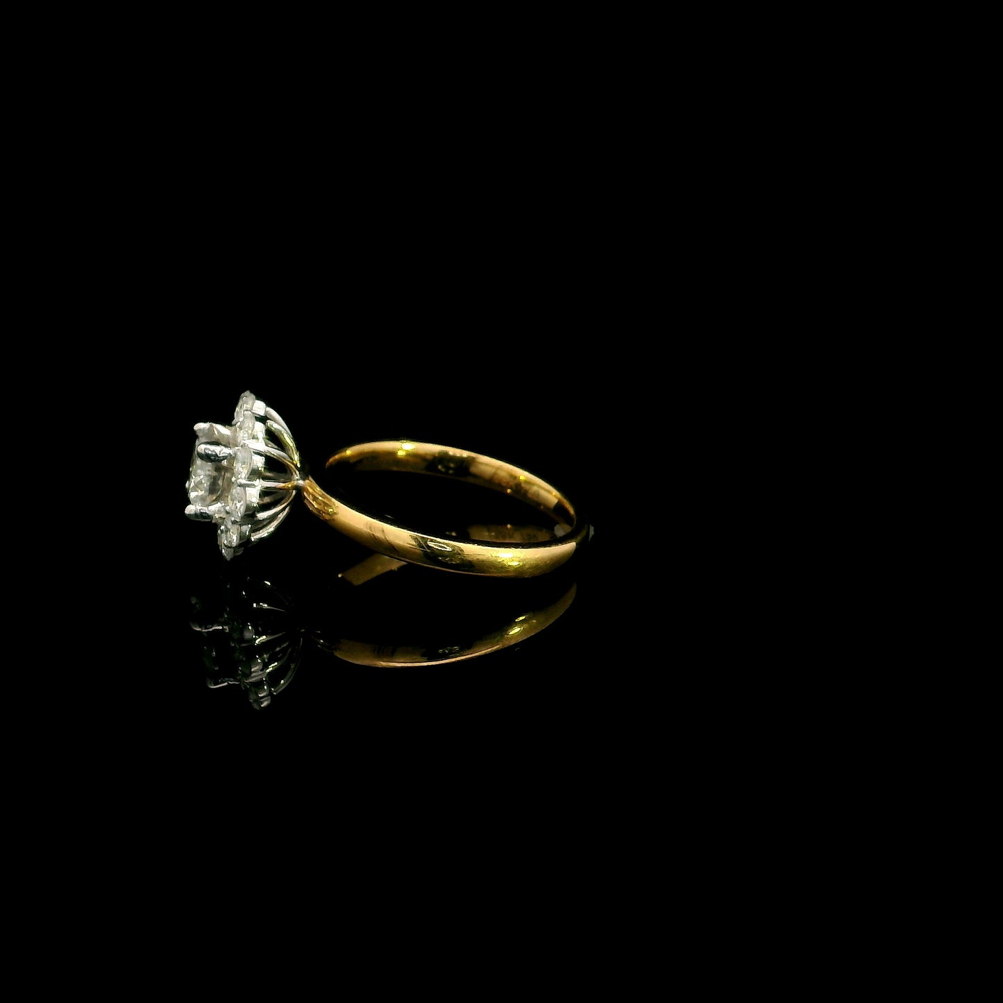 Natural diamond halo engagement ring in solid 18K yellow gold featuring a 0.70 carat IGI certified round brilliant centre diamond surrounded by 0.51 carat natural diamonds.