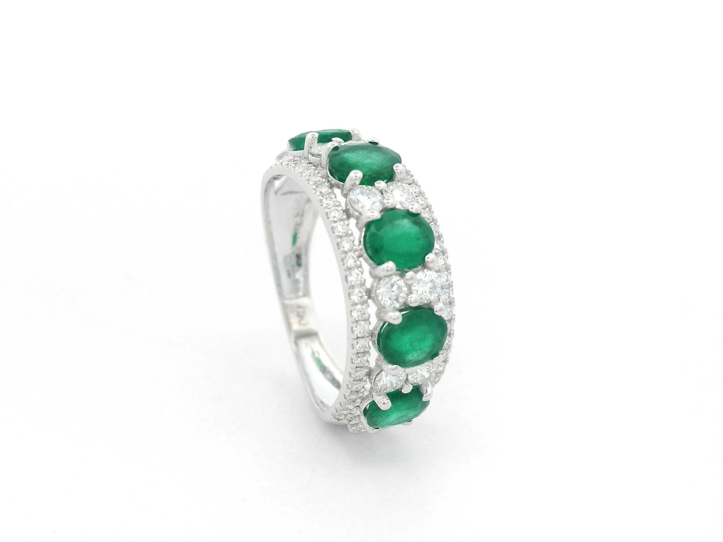 Emerald and diamond five-stone ring in 18K white gold with accents by Emirates Diamonds.