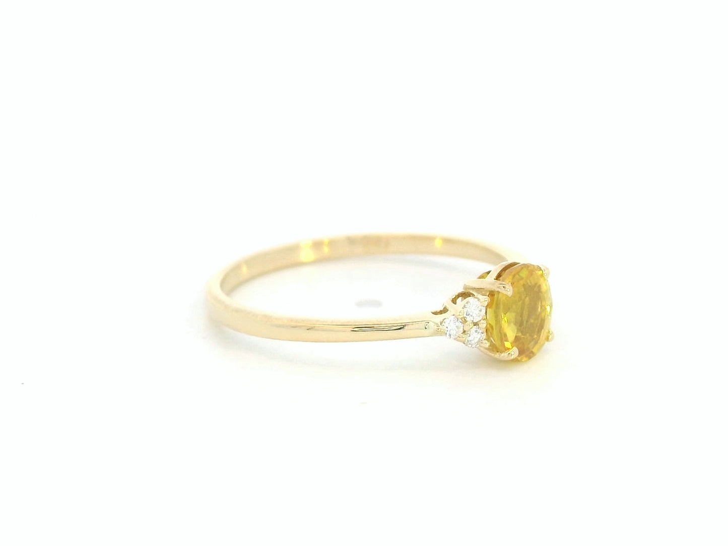 18K yellow gold ring with oval yellow sapphire and diamond accents, elegant gemstone ring by Emirates Diamonds