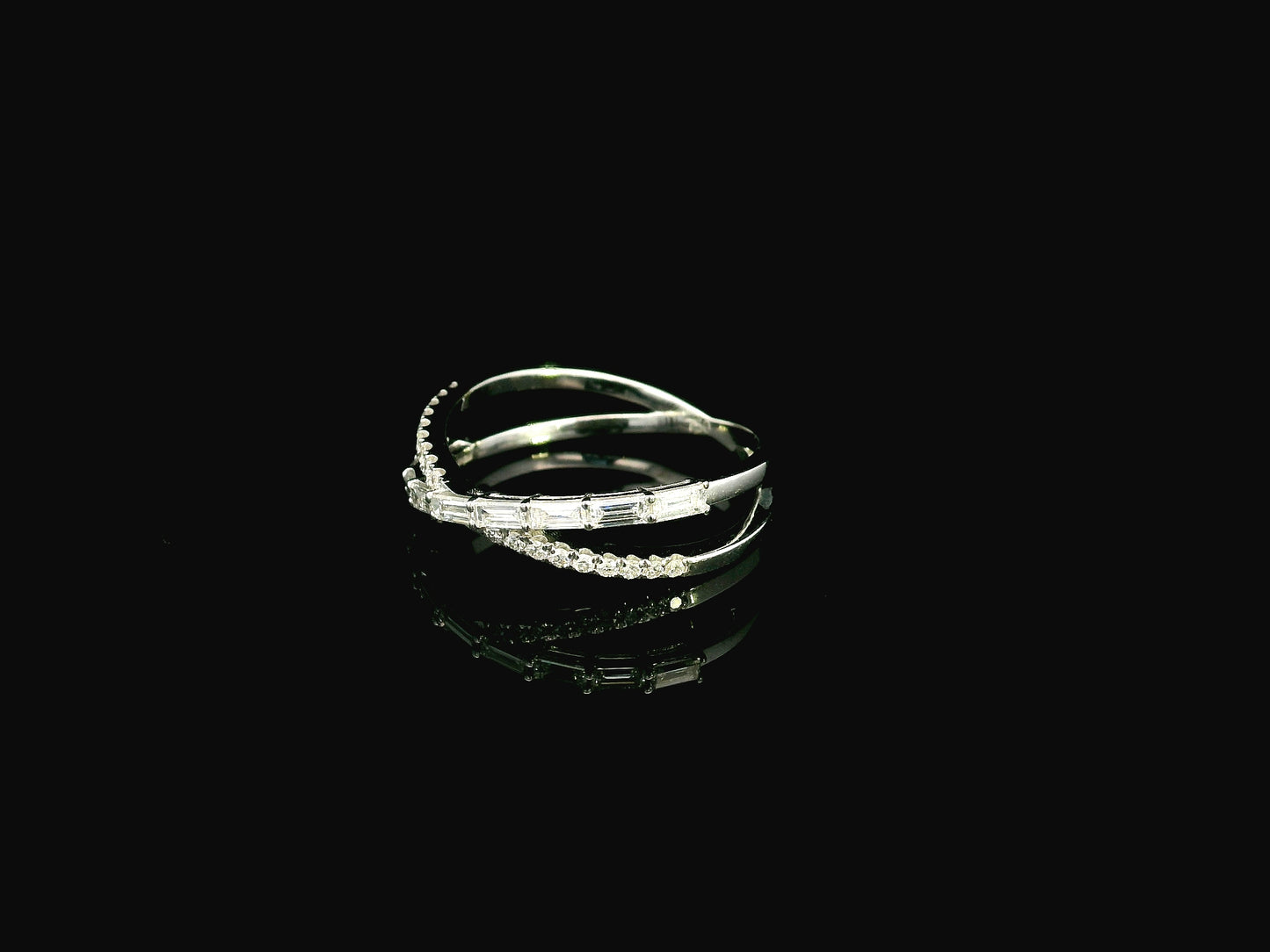 Baguette and round diamond crossover ring in 18K white gold criss-cross design Emirates Diamonds