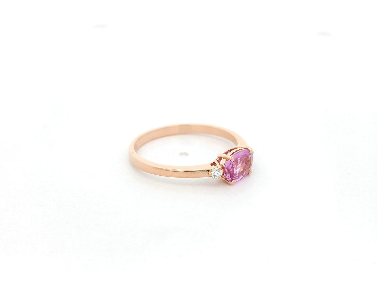 Oval pink sapphire ring with diamond accents in 18K rose gold by Emirates Diamonds