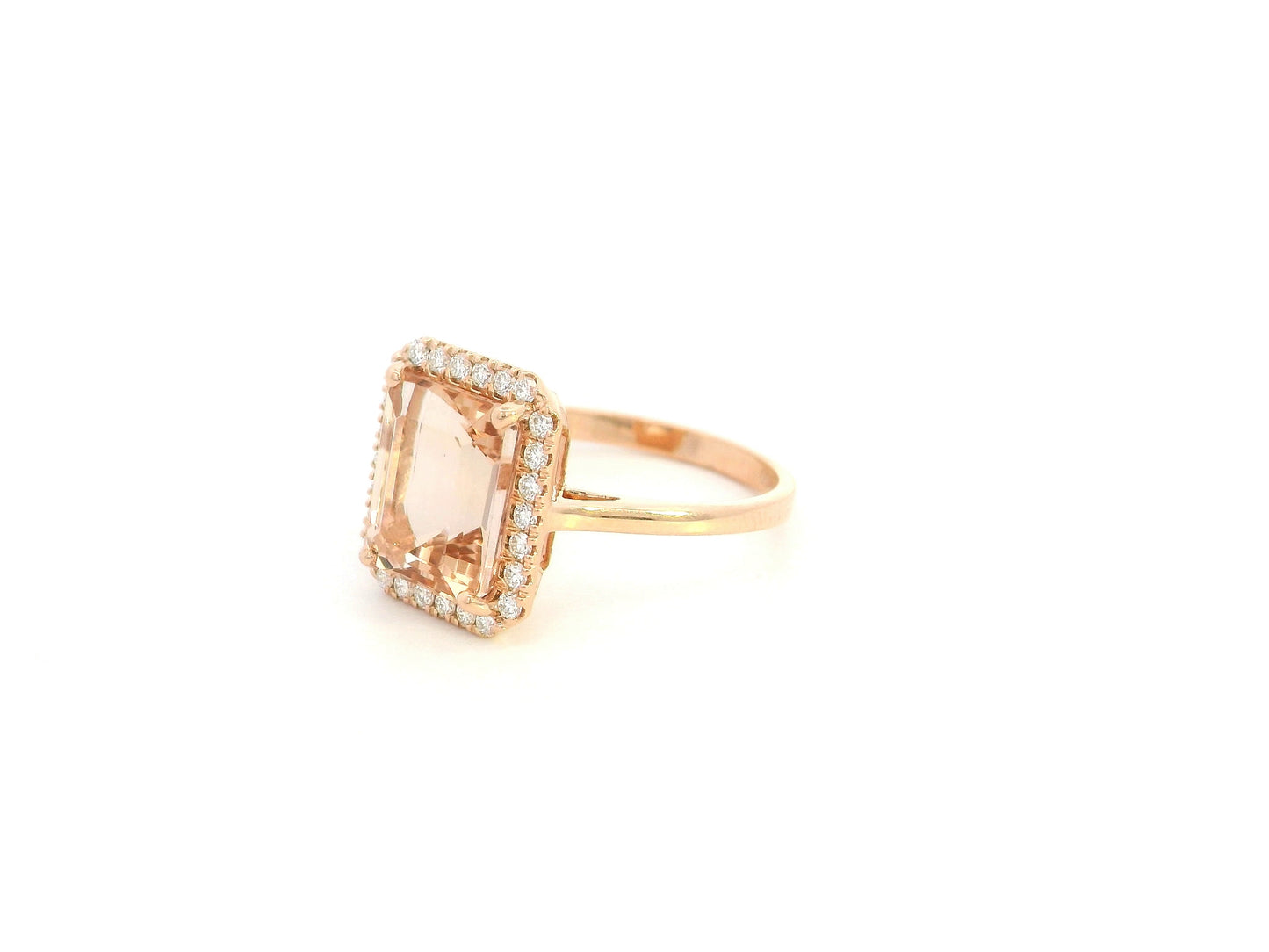 Emerald cut morganite halo ring with diamonds in 18K rose gold by Emirates Diamonds