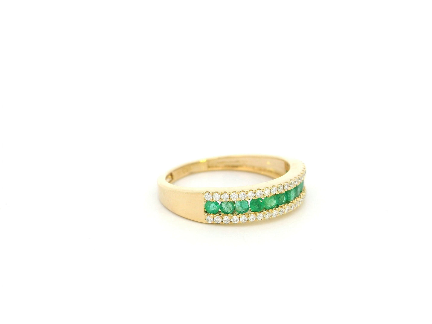 Emerald and diamond band ring in 18K yellow gold with channel set design by Emirates Diamonds