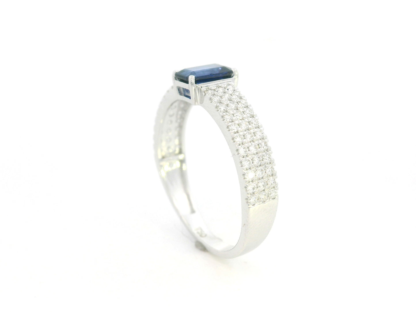 Emerald cut sapphire and diamond ring in 18K white gold