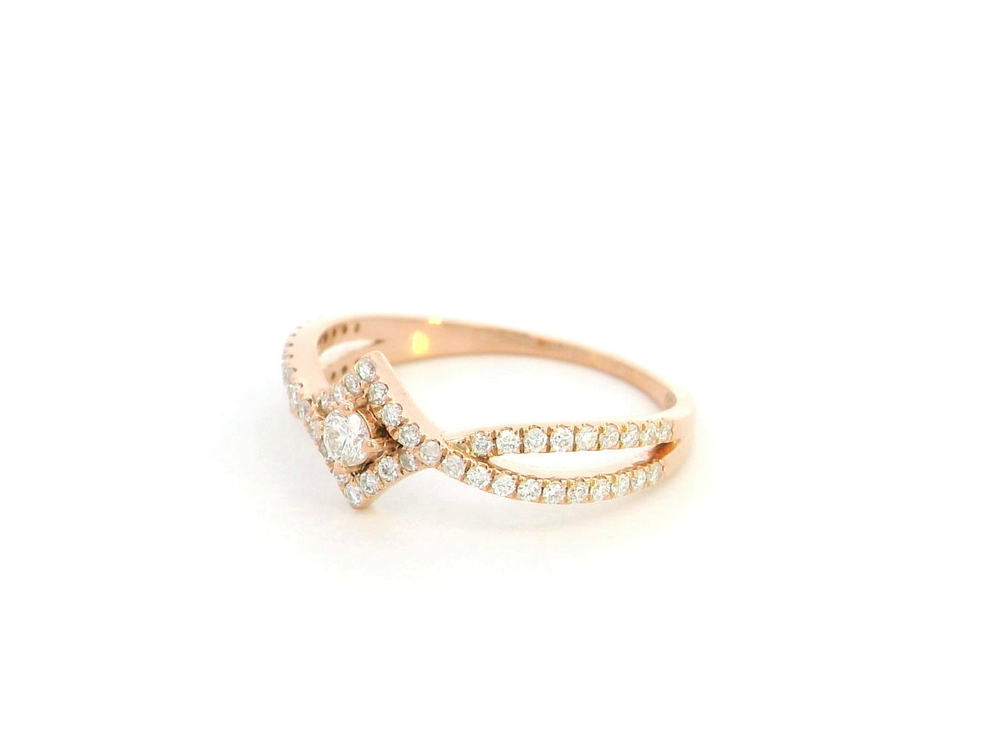 Diamond halo twist ring in 18K rose gold featuring 0.39 carat natural diamonds
