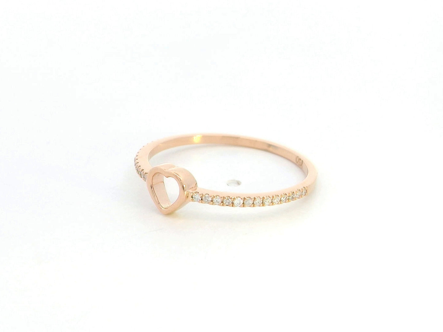 18K rose gold diamond heart ring with pavé-set diamonds and minimalist open heart design.