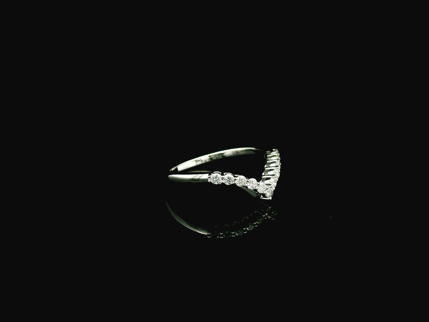 Diamond chevron wedding band ring in 18K white gold featuring 0.36 carat natural diamonds in a V-shaped design.