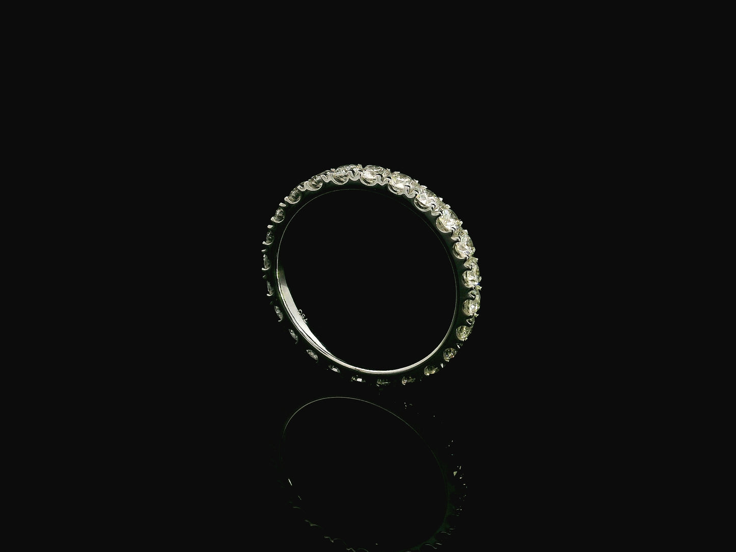 18K white gold full eternity diamond ring featuring 1.88 carats of natural round brilliant diamonds in prong setting, handcrafted as a made-to-order wedding band.