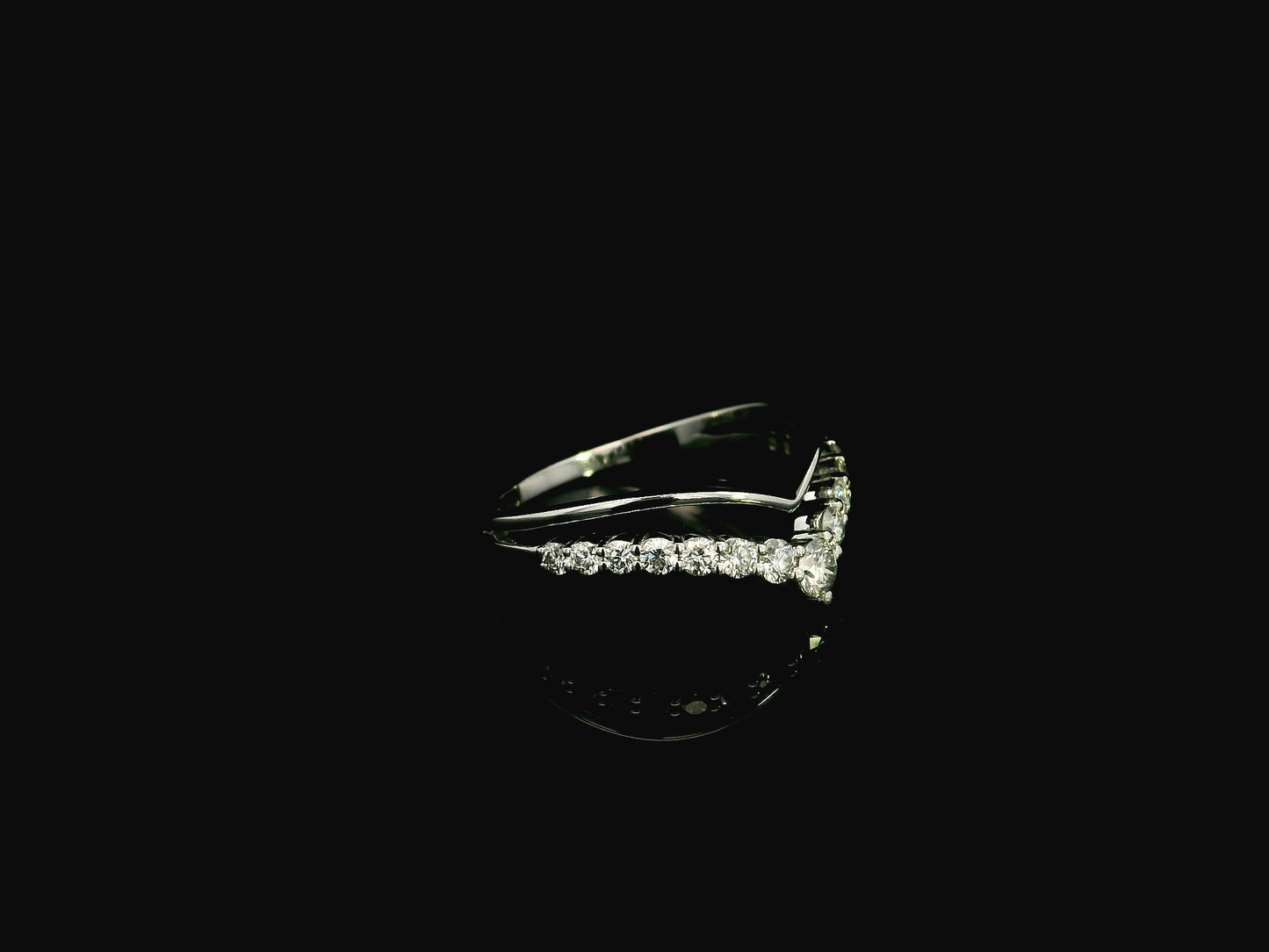 18K white gold graduated chevron diamond ring featuring 0.57 carats of natural diamonds in a V-shaped contour design, perfect as a wedding band, stack ring, or engagement ring enhancer.