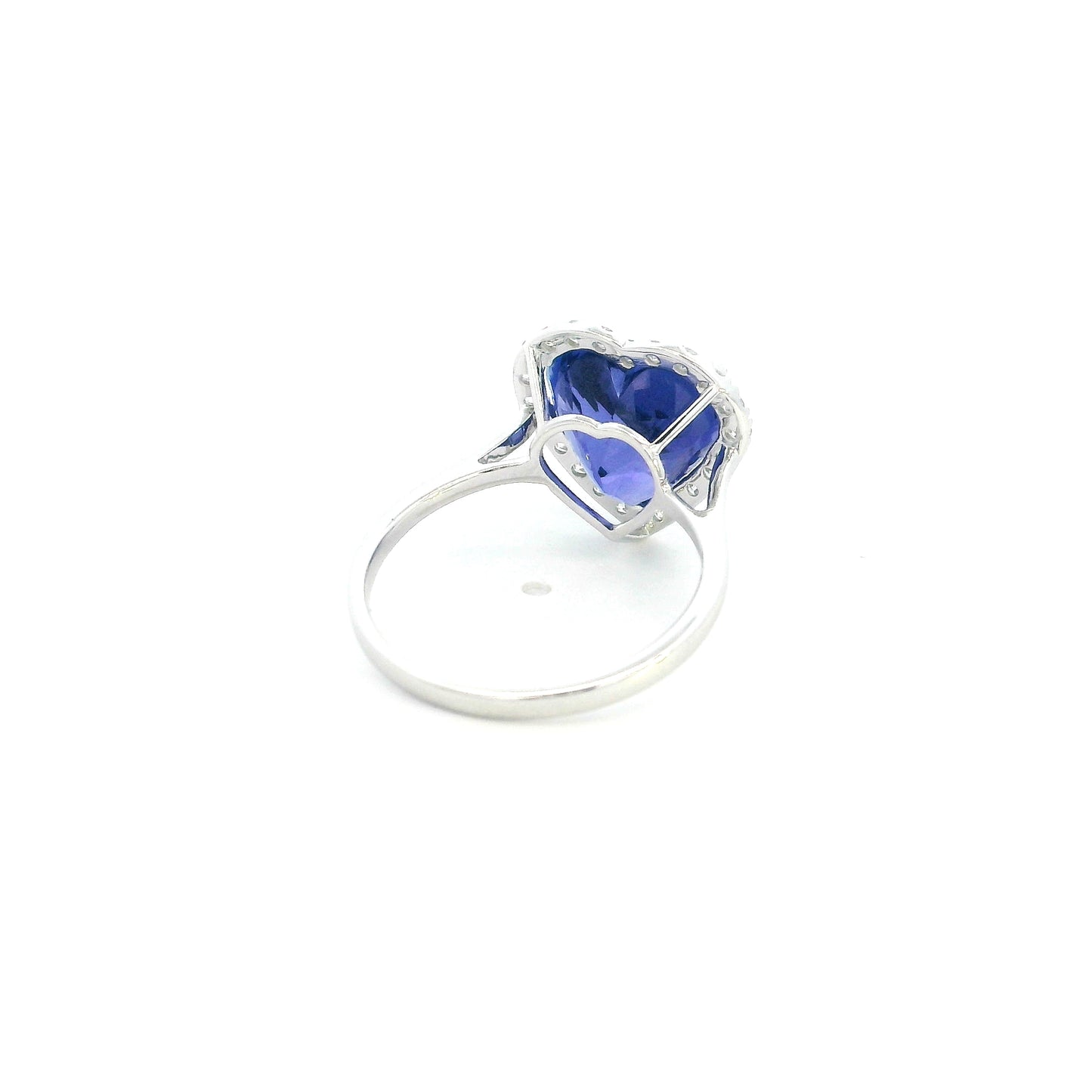 18K white gold heart tanzanite halo ring featuring a 5.89 Carat natural heart-shaped tanzanite surrounded by natural diamonds.