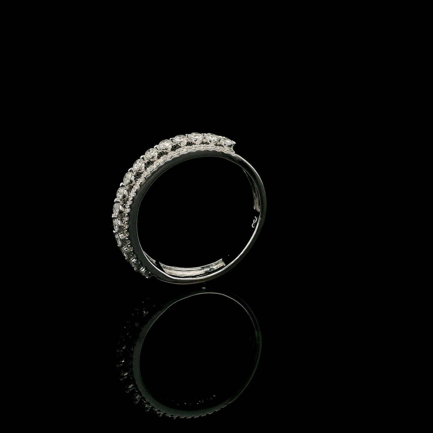 Natural three row diamond wedding band in solid 18K white gold featuring an elevated centre row of round brilliant diamonds with two pavé diamond rows, total diamond weight 0.62 carat.