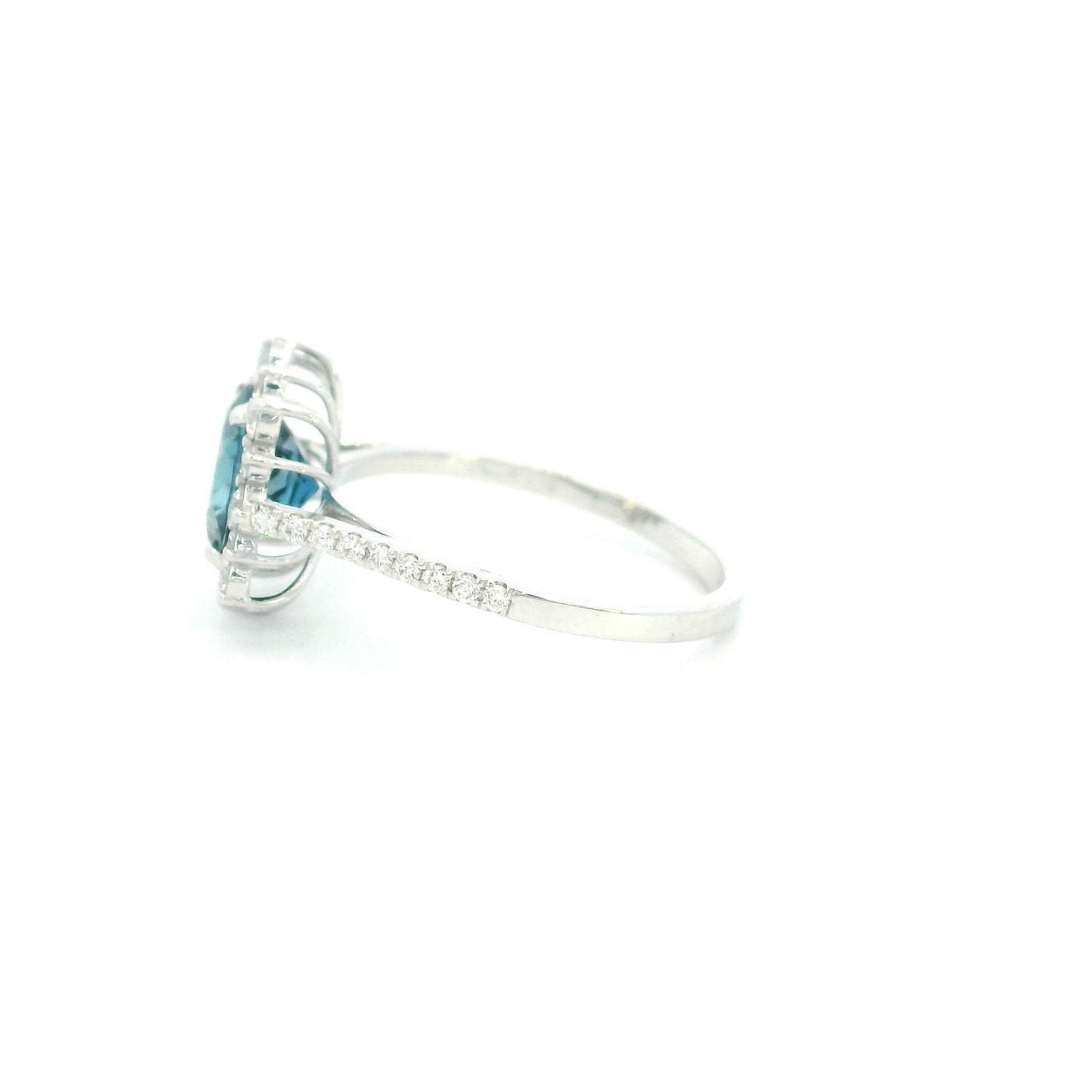 18K white gold London Blue Topaz halo ring featuring a 2.04 Carat round natural topaz surrounded by a sparkling natural diamond halo.