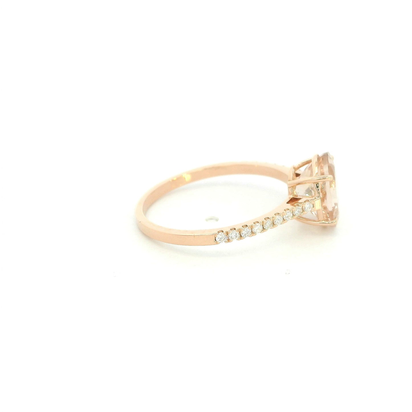 Oval morganite diamond ring handcrafted in 18K rose gold featuring a 1.84 carat natural oval morganite with 0.16 carat natural diamond pavé band.