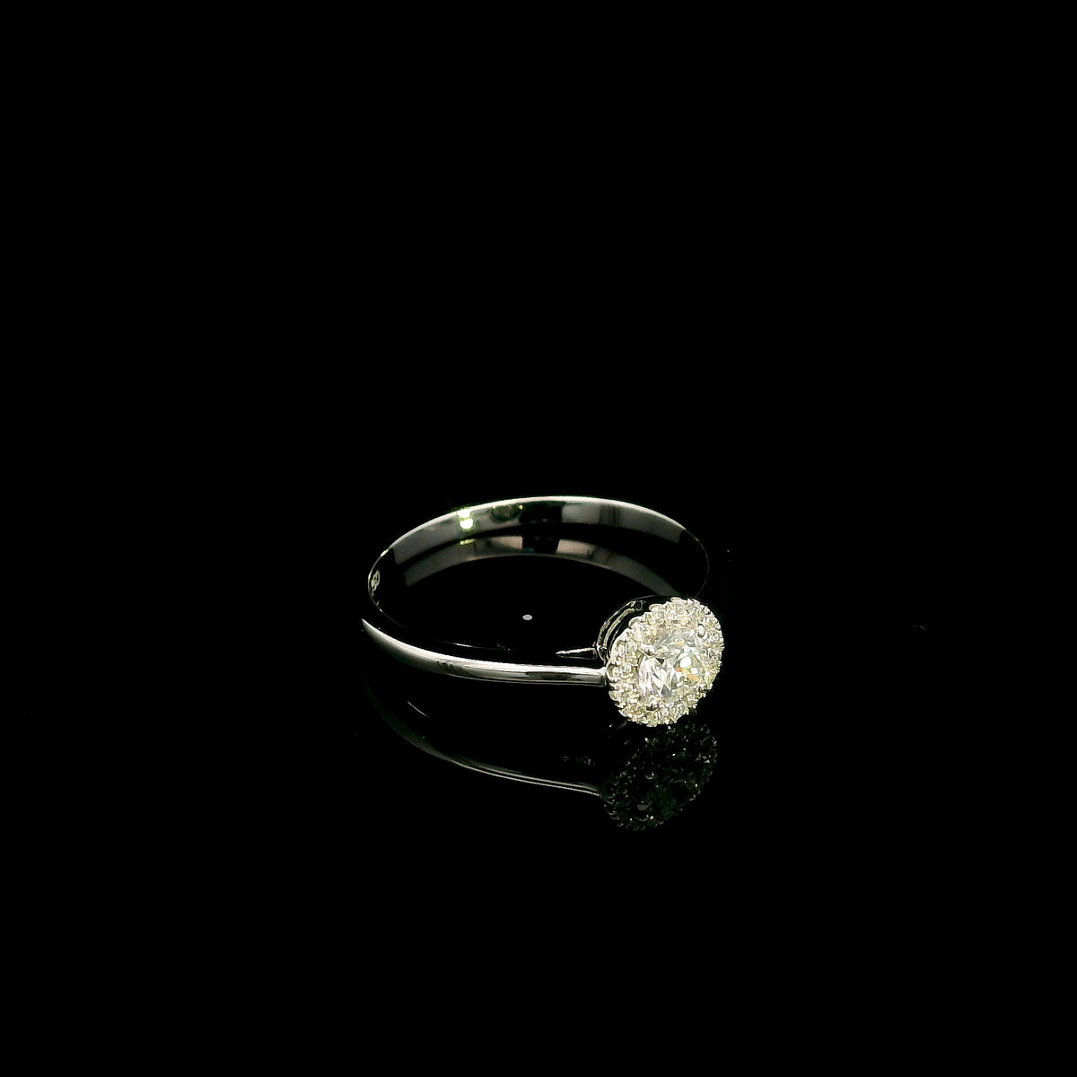 Round diamond halo engagement ring in 18K white gold