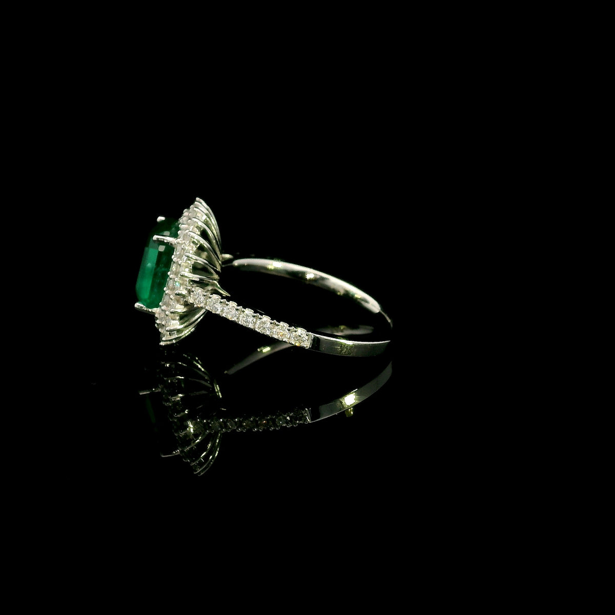 Emerald and Diamond Halo Ring in 18K White Gold