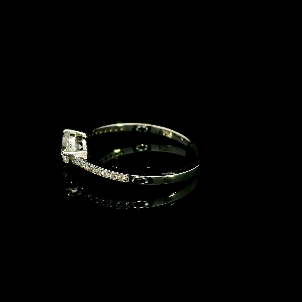 GIA certified round diamond engagement ring in 18K white gold with curved diamond band