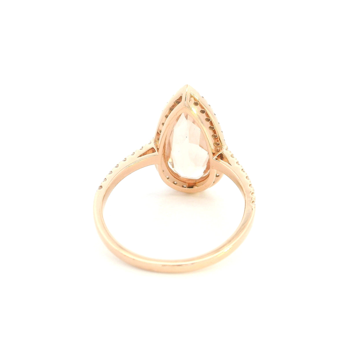 Pear shaped morganite ring in 18K rose gold with a 2.58 carat pink gemstone, round diamond halo and pavé diamond band.