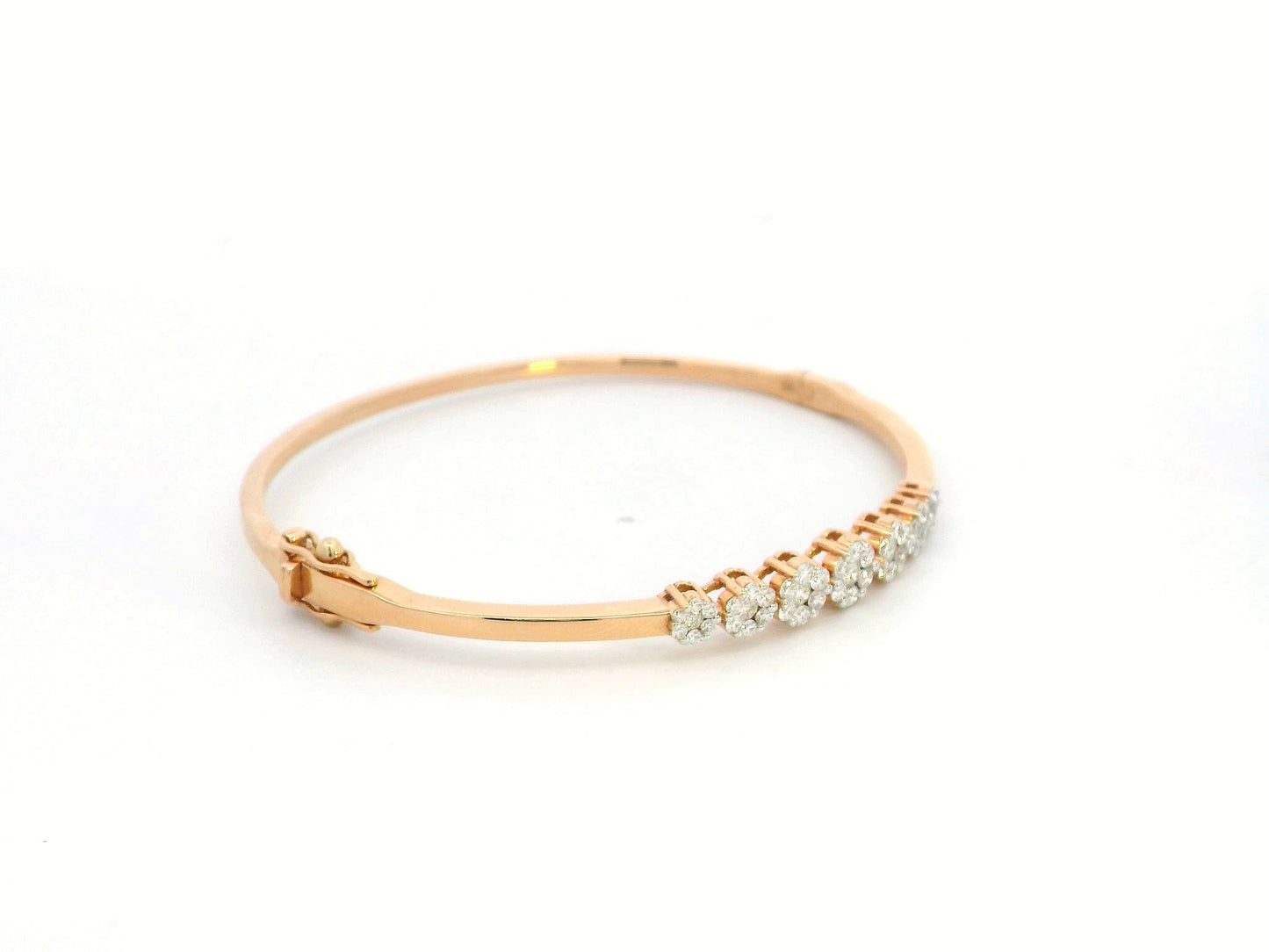 18K gold diamond bangle bracelet featuring 0.95 carats of round-cut diamonds in a clustered design, blending elegance with modern minimalism.