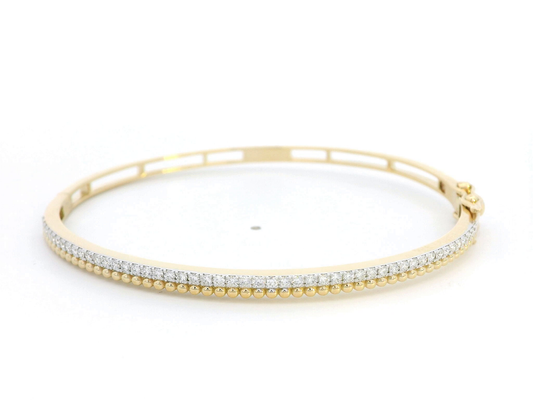 18K gold diamond bangle bracelet with beaded details and 0.57 carats of diamonds, featuring a sleek and elegant design.