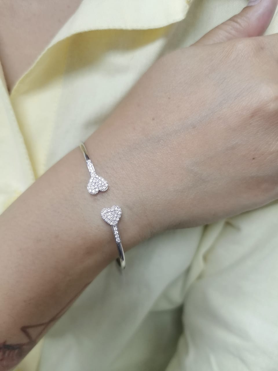 18K gold open bangle with pavé diamond heart ends – minimalist romantic bracelet