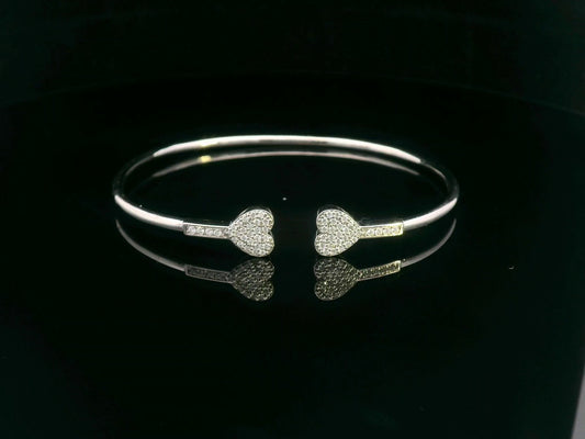 18K gold open bangle with pavé diamond heart ends – minimalist romantic bracelet