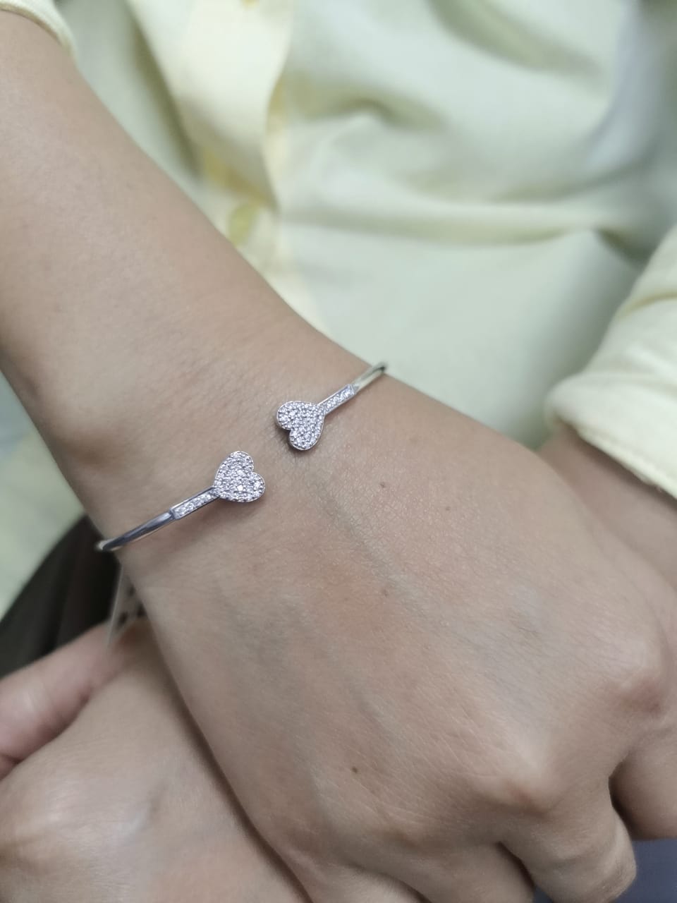 18K gold open bangle with pavé diamond heart ends – minimalist romantic bracelet