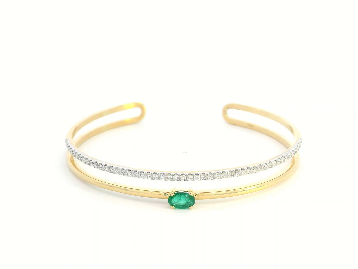 18K yellow gold open bangle with oval emerald and diamond band – 0.48ct emerald and 0.59ct diamond