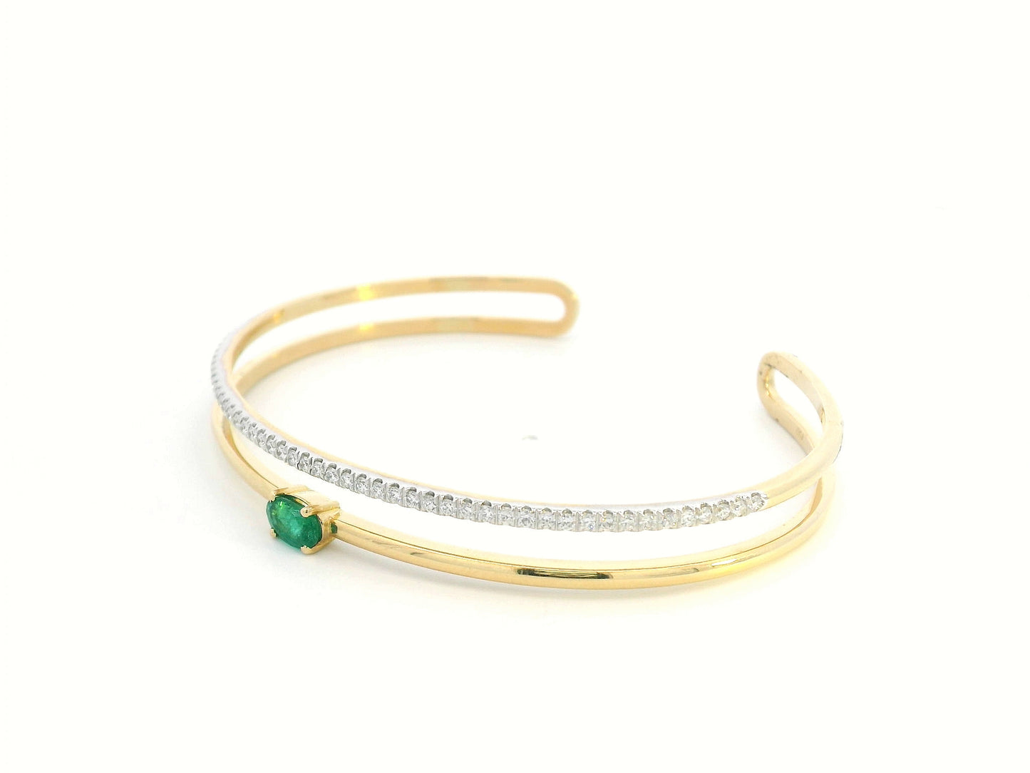 18K yellow gold open bangle with oval emerald and diamond band – 0.48ct emerald and 0.59ct diamond