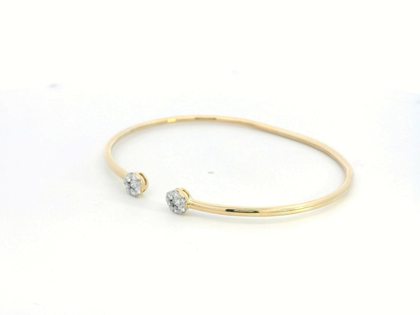 18K gold open bangle with round diamond cluster ends totaling 0.46 carats