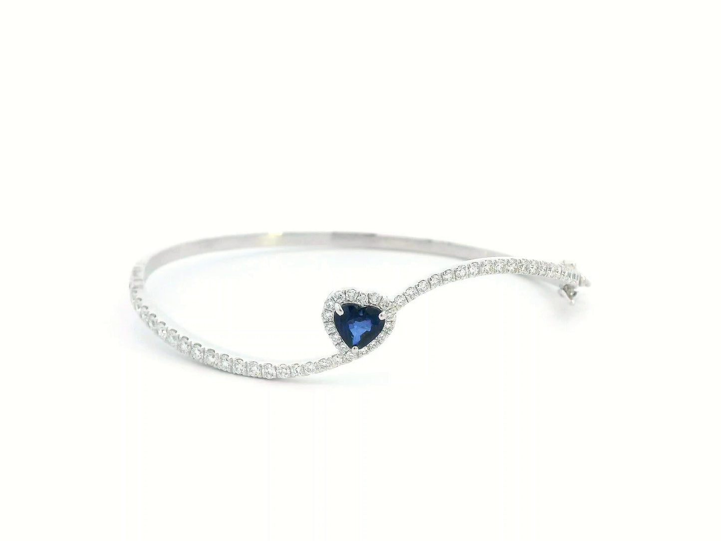 18K white gold bangle with heart-shaped 0.73ct blue sapphire and 1.2ct diamond halo and accents