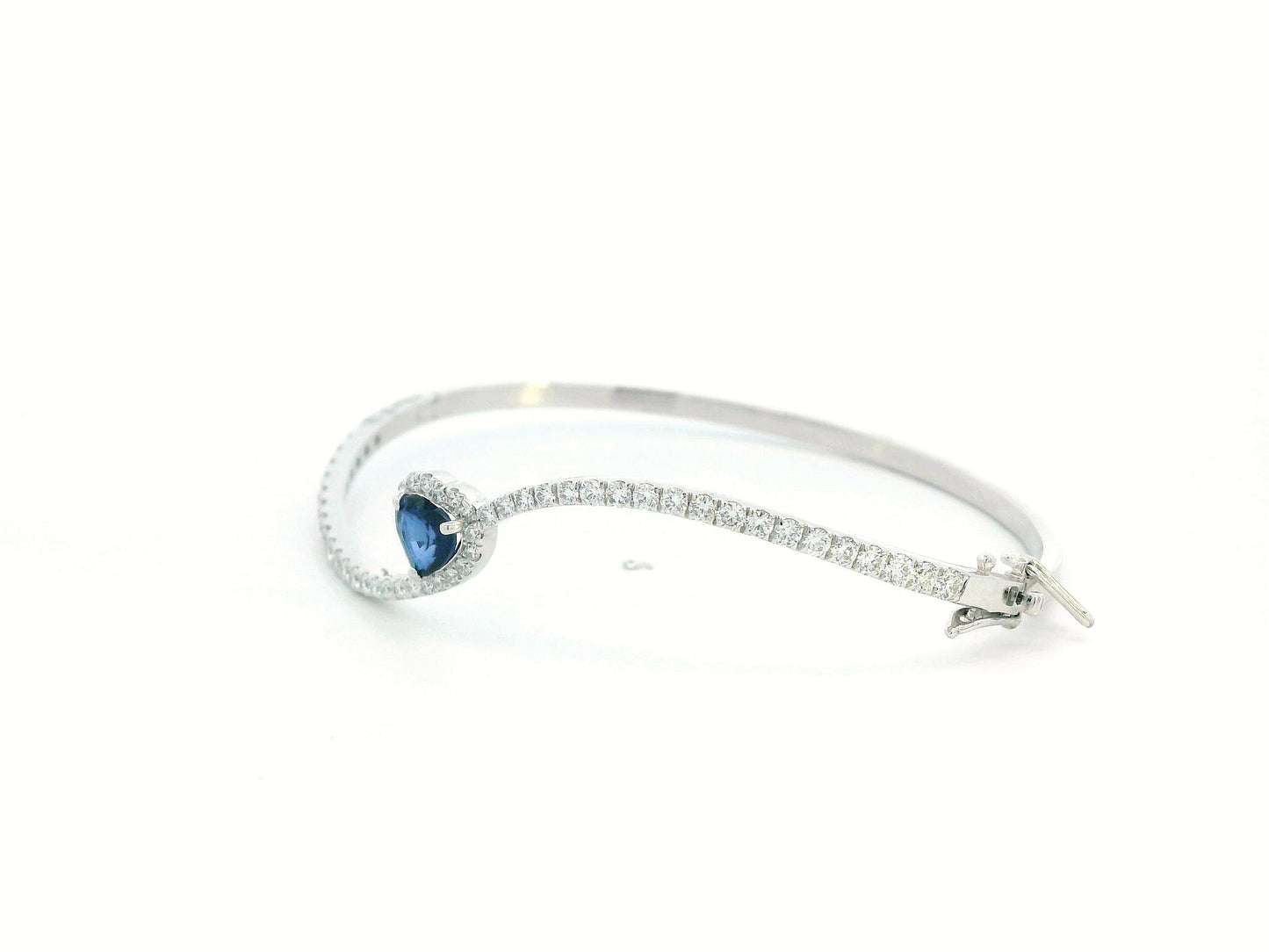 18K white gold bangle with heart-shaped 0.73ct blue sapphire and 1.2ct diamond halo and accents