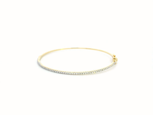 18K gold diamond bangle bracelet featuring 0.55 carats of round-cut diamonds, designed for timeless elegance and luxury.