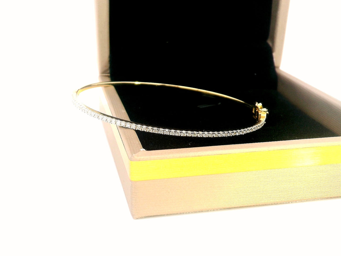 18K gold diamond bangle bracelet featuring 0.55 carats of round-cut diamonds, designed for timeless elegance and luxury.