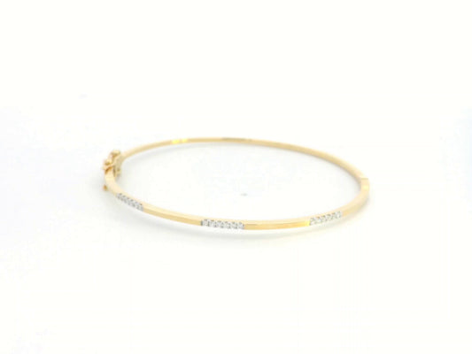 18K yellow gold minimalist bangle with 0.17 carat round-cut diamonds in triple accent design