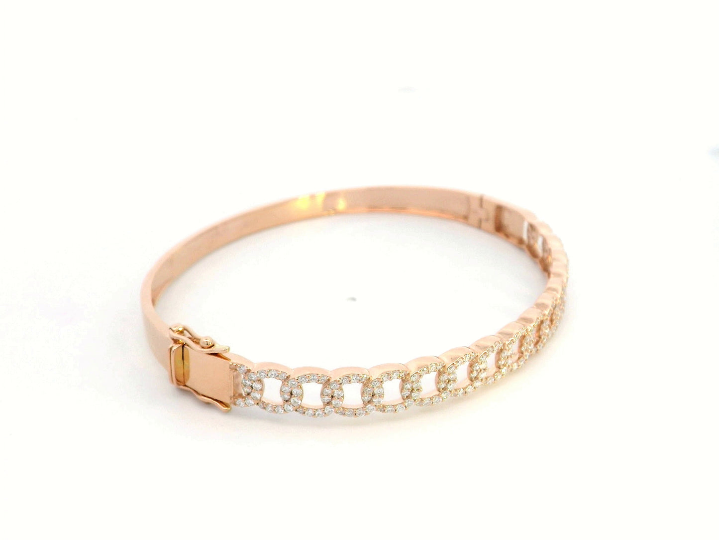 Unisex Cuban link diamond bangle in 18K rose gold with 1.26 carats of round-cut diamonds.