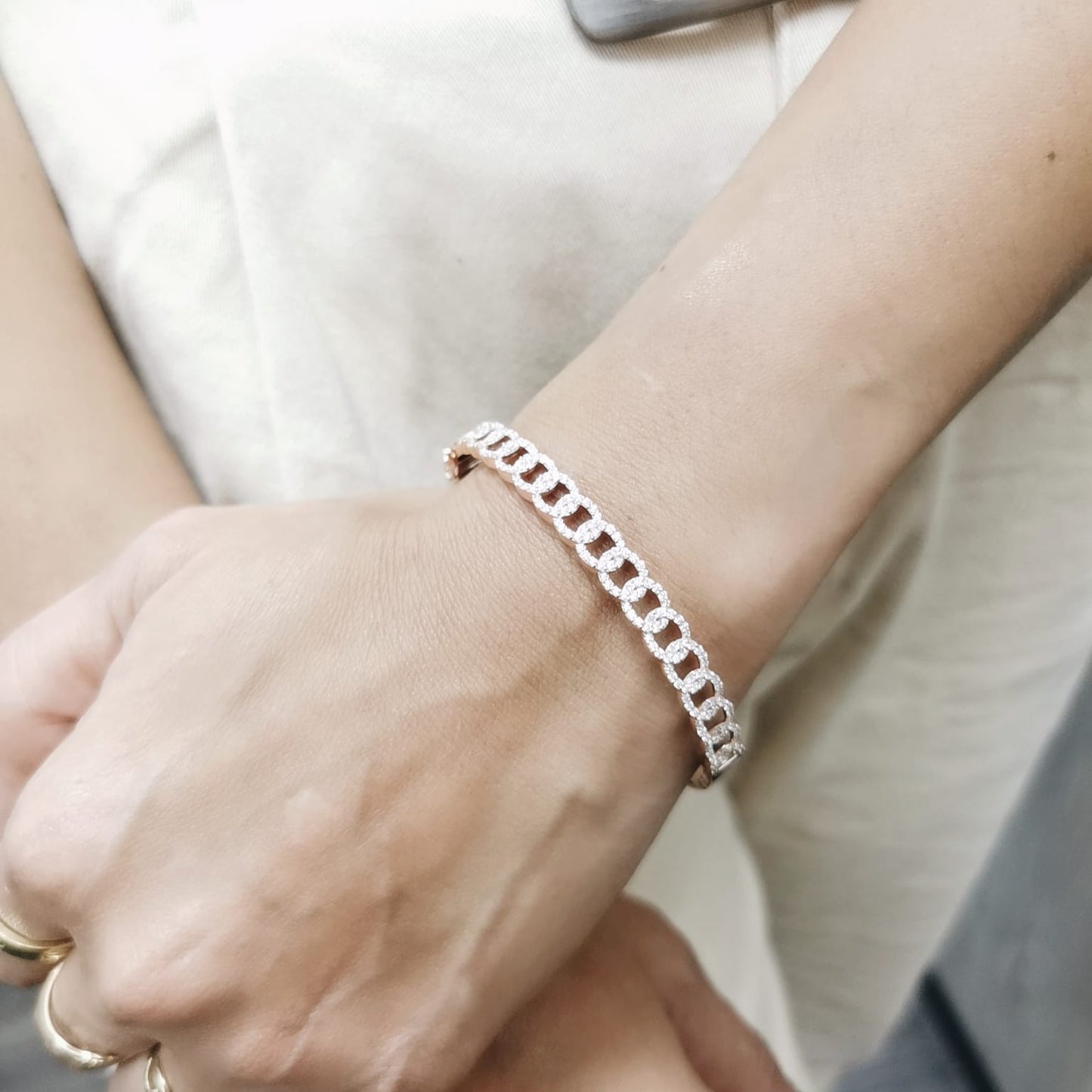 Unisex Cuban link diamond bangle in 18K rose gold with 1.26 carats of round-cut diamonds.