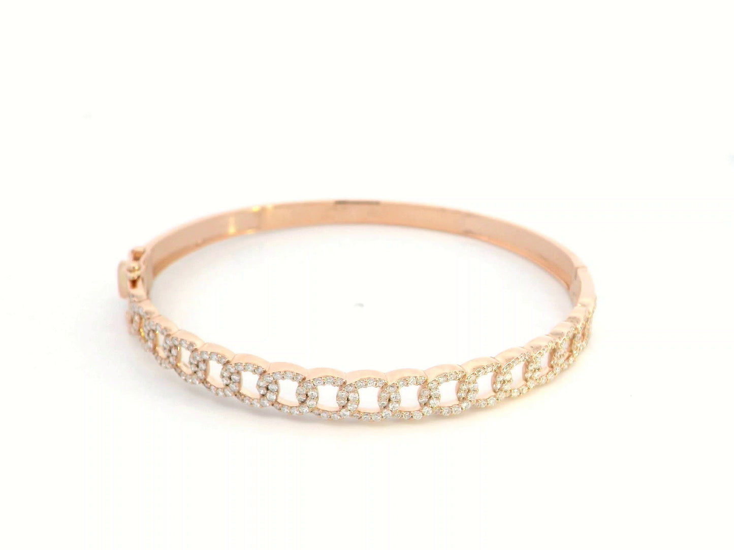 Unisex Cuban link diamond bangle in 18K rose gold with 1.26 carats of round-cut diamonds.