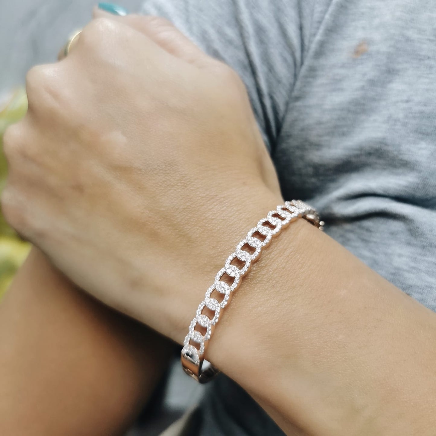 Unisex Cuban link diamond bangle in 18K rose gold with 1.26 carats of round-cut diamonds.