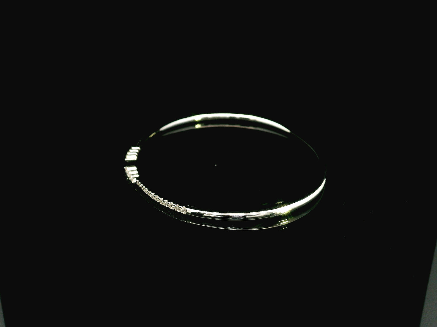 18K white gold diamond bangle featuring 0.54 carat natural diamonds in an elegant open bangle design.