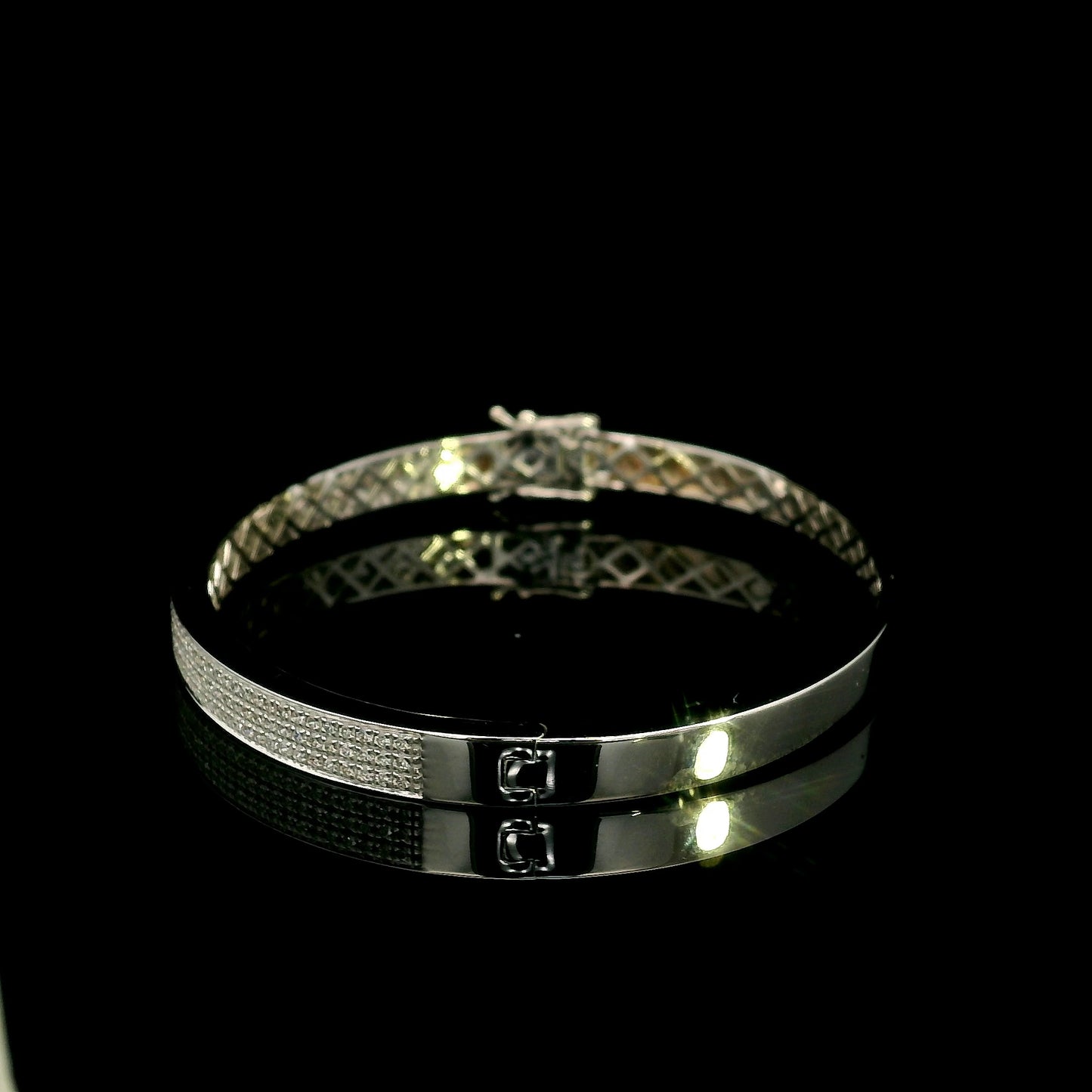 18K white gold multi-row diamond bangle set with 1.45 carats of natural round diamonds.