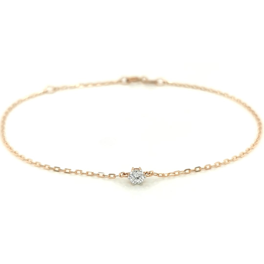 This Solitaire Diamond Bracelet, crafted from 18k Yellow Gold, is the perfect way to add a subtle sparkle to your wrist. The minimalist design features a single diamond, allowing you to make a subtle yet elegant statement.