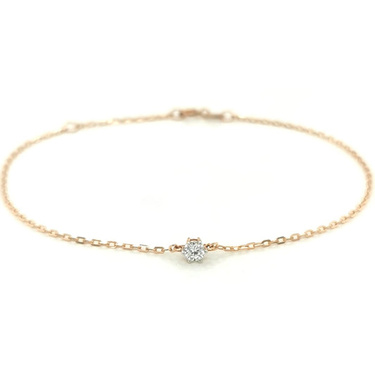 This Solitaire Diamond Bracelet, crafted from 18k Yellow Gold, is the perfect way to add a subtle sparkle to your wrist. The minimalist design features a single diamond, allowing you to make a subtle yet elegant statement.