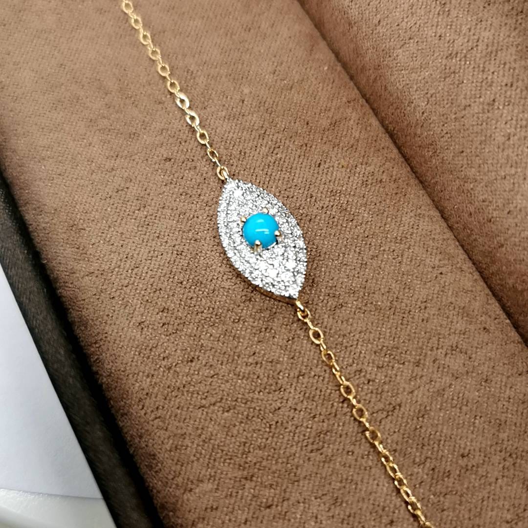 18K Gold Eye-Shaped Turquoise and Diamond Bracelet with 0.41 Carat Diamonds
