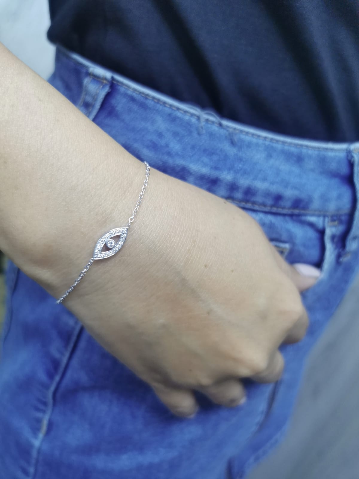 18K white gold evil eye bracelet with 0.14 carat diamonds on a delicate chain