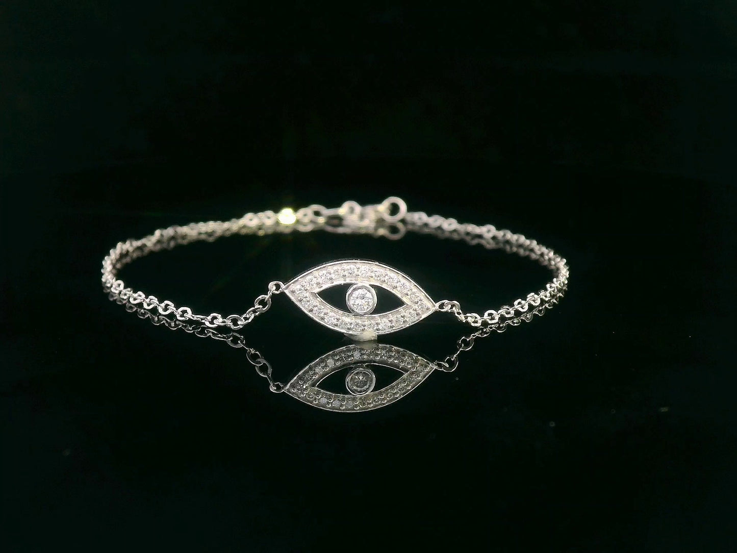 18K white gold evil eye bracelet with 0.14 carat diamonds on a delicate chain